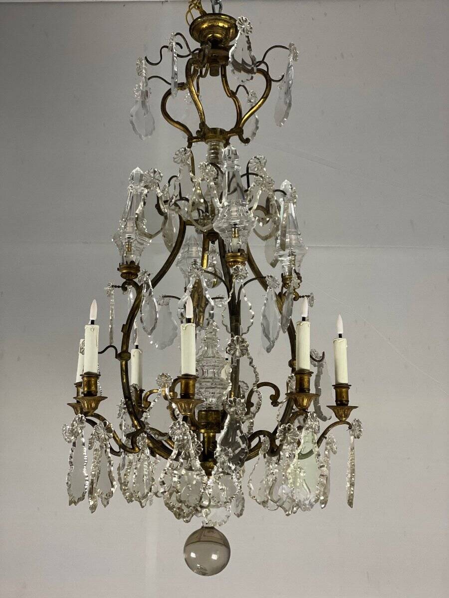 Bronze cage chandelier adorned with cut crystal pendants, 12 lights