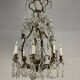 Bronze cage chandelier adorned with cut crystal pendants, 12 lights