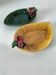 Two relief bowls with leaf designs, radishes, and tomatoes.