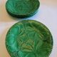 8 green barbotine plates from the early 20th century.