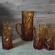 Pitcher and its glasses in amber glass