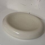 Empty pocket, cracked ceramic dish 1980