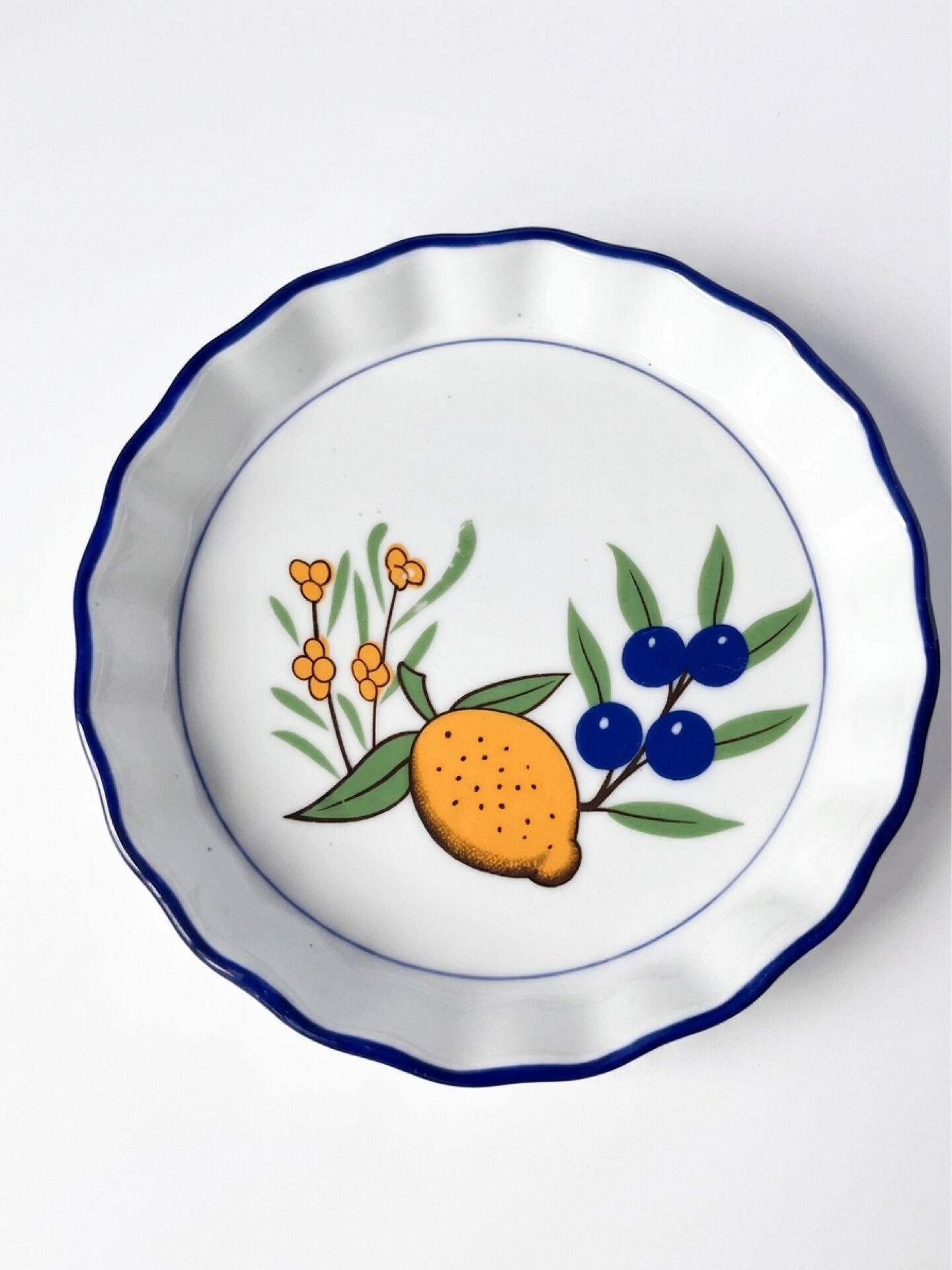Set of 3 vintage ceramic dishes with wicker baskets.