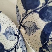 Two flat plates in earthenware with blue floral decoration.