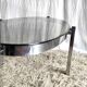 Table basse de forme élyptique en metal chomé et verre fumé, années 70