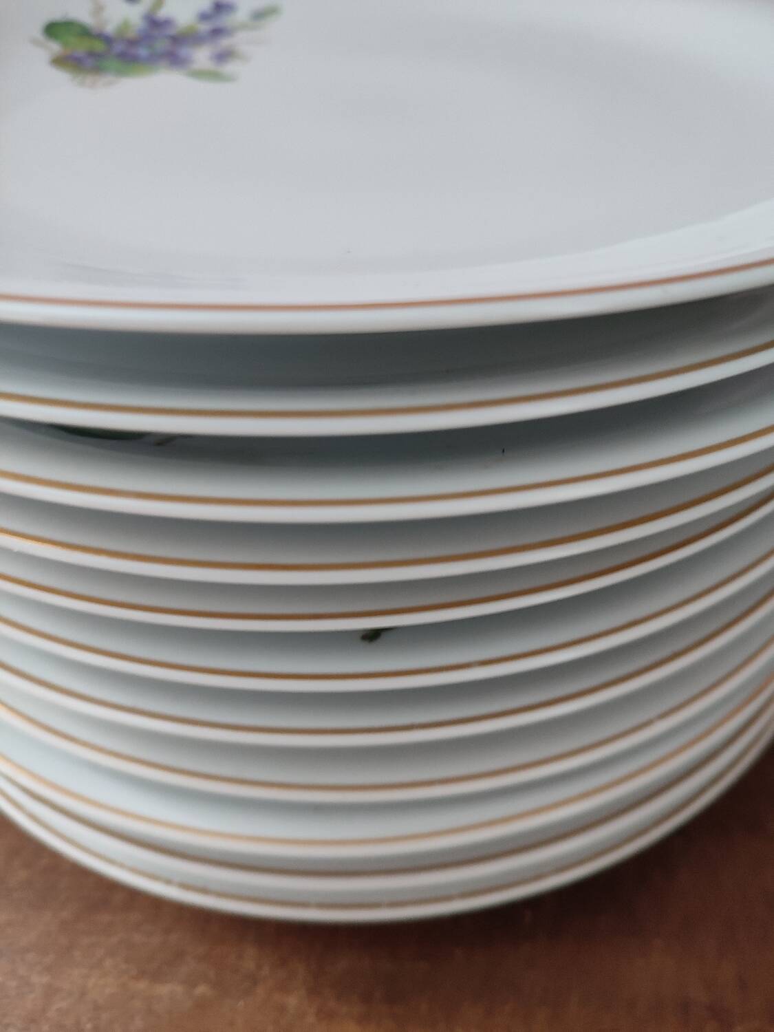 Set of 11 plates, Baudour porcelain