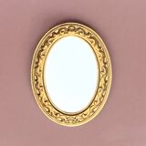 Small vintage wall mirror in gold resin