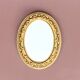 Small vintage wall mirror in gold resin