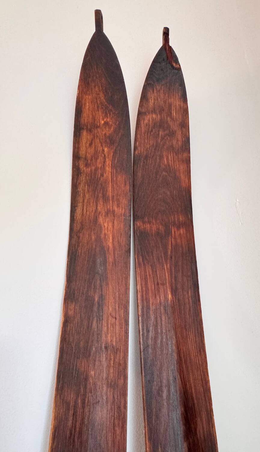 Antique wooden skis with vintage poles