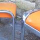 Pair of chrome and faux orange vintage stools "70"