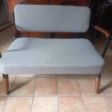 Two-seater sofa in fabric, metal and wooden armrests
