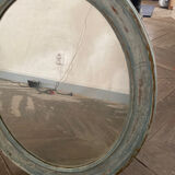 Patinated oval mirror