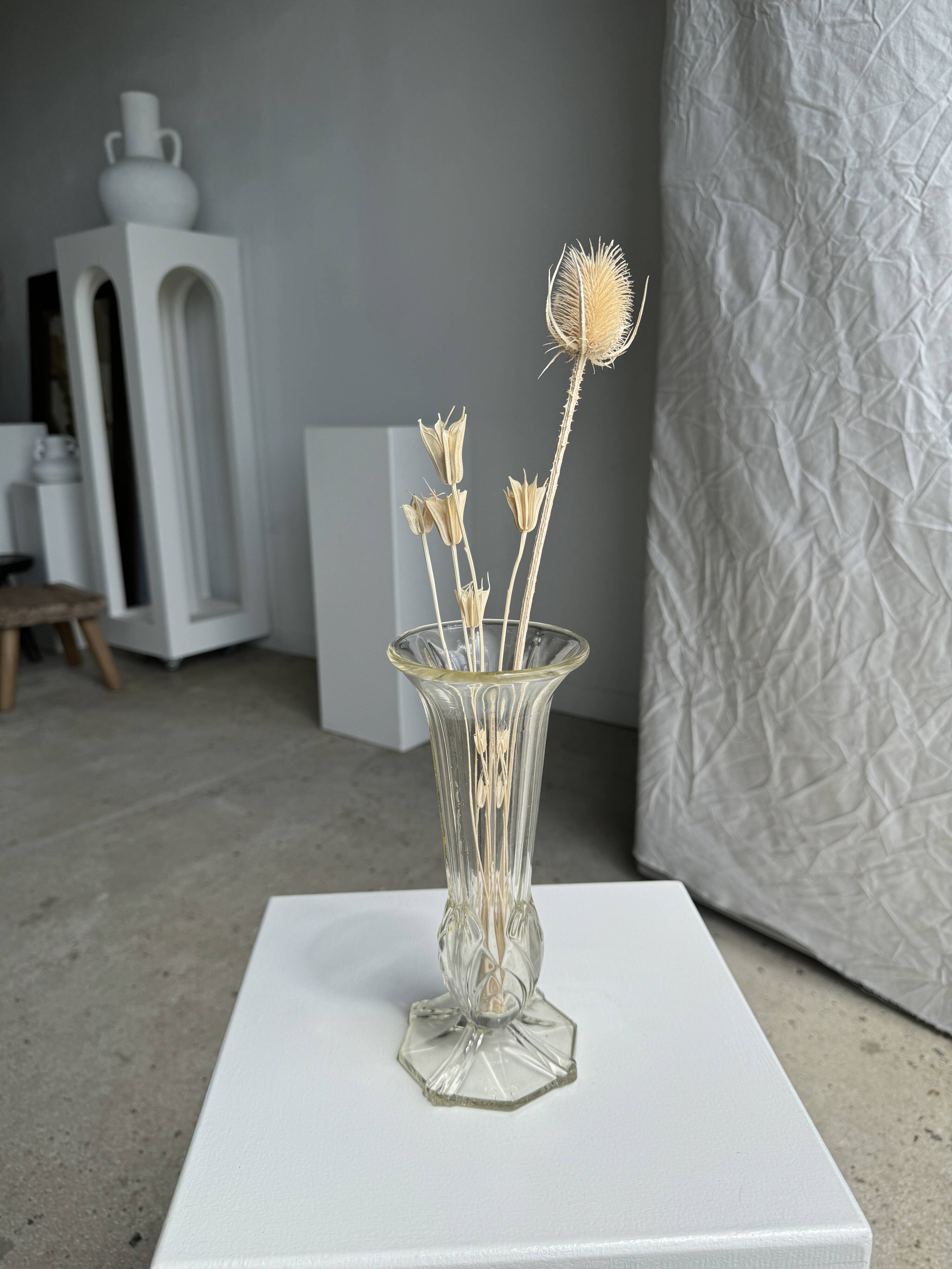 Art deco style flared neck pedestal vase in blown glass