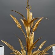 Golden suspension on ears of wheat, circa 1960