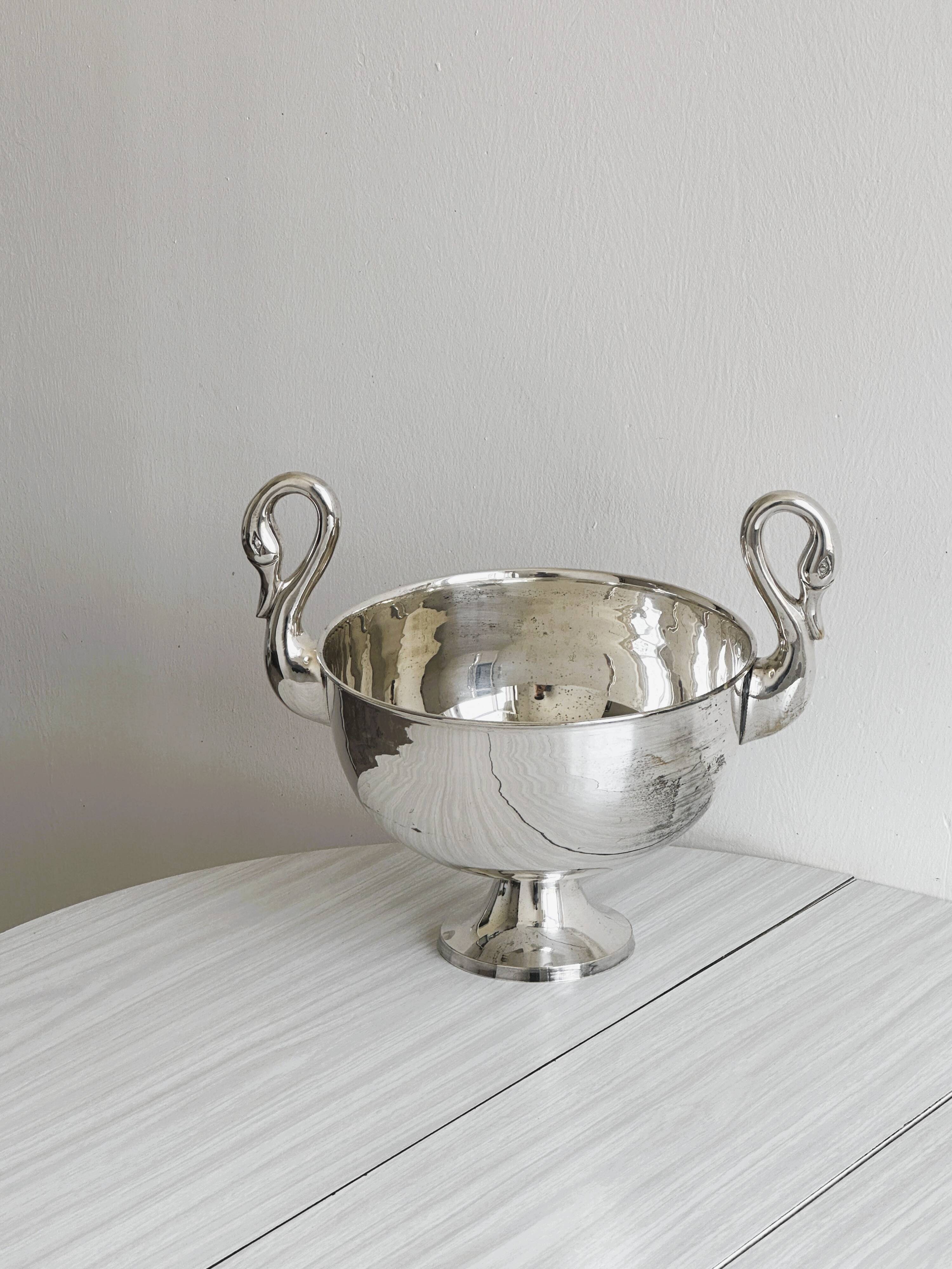 Large glass, metal champagne bucket