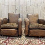 Paire de fauteuils Club en cuir usés