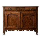 Old low sideboard in solid wood with drawers and doors.
