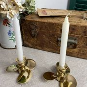 Pair of vintage brass propeller-shaped candlesticks