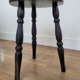 Black wooden tripod stool