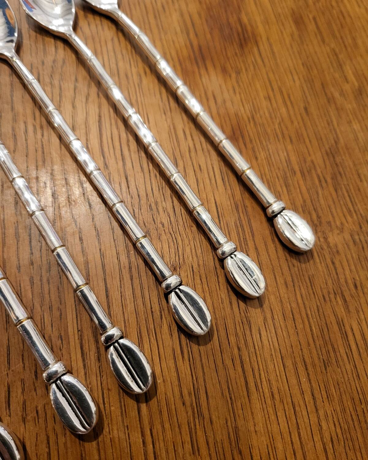 6 long silver-plated metal spoons