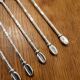 6 long silver-plated metal spoons