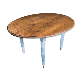 Oval table with removable flap