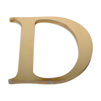 Letter sign in gold metal "D" 1980