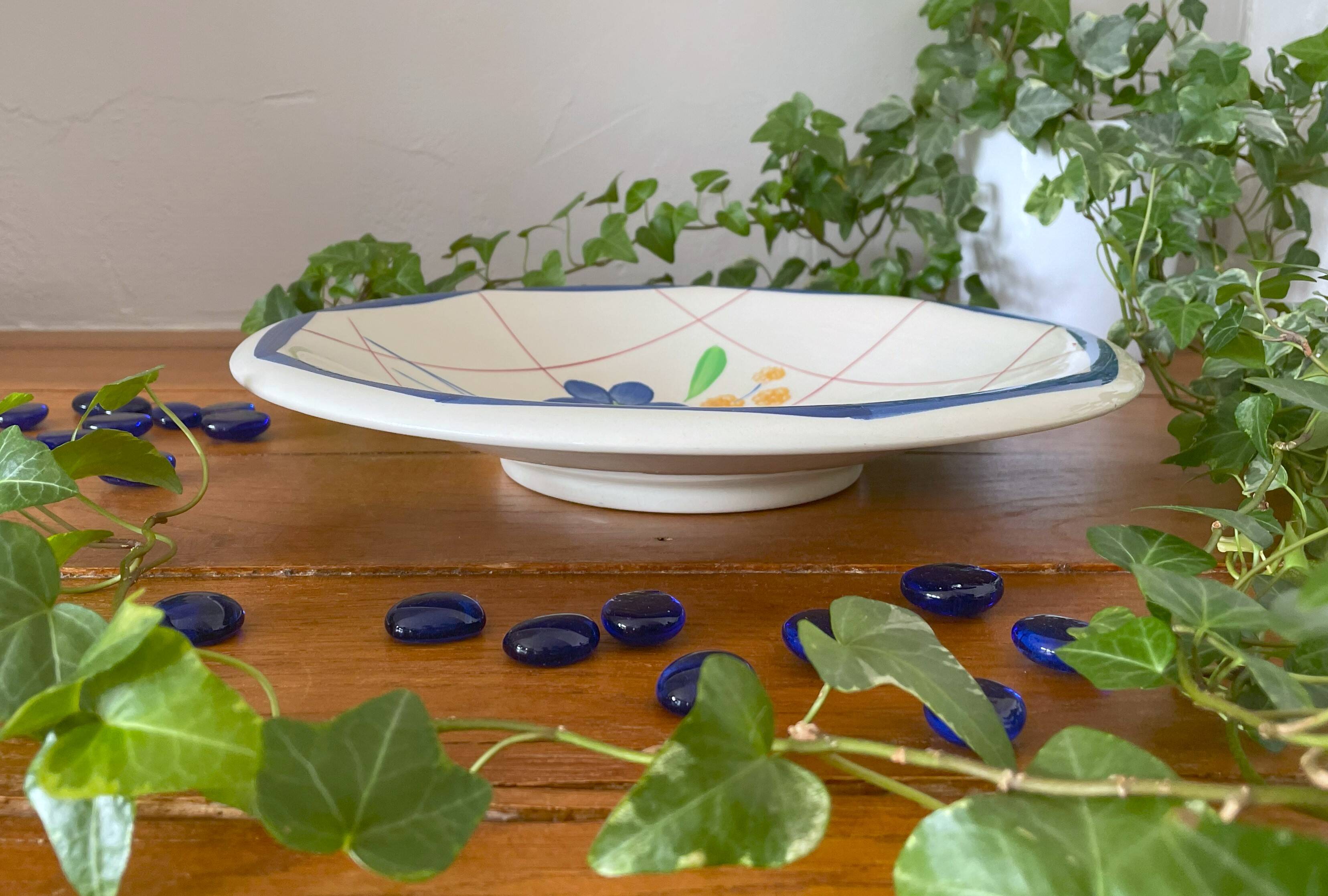 Large antique salad bowl on a Gien earthenware pedestal