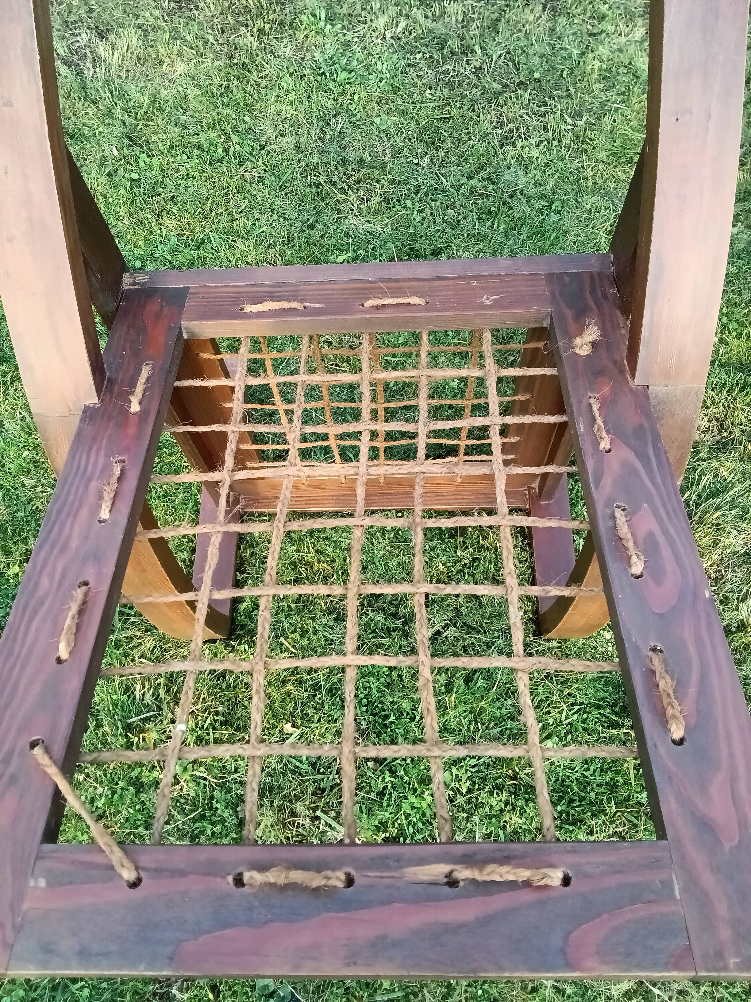 A pair of vintage rope and wood armchairs