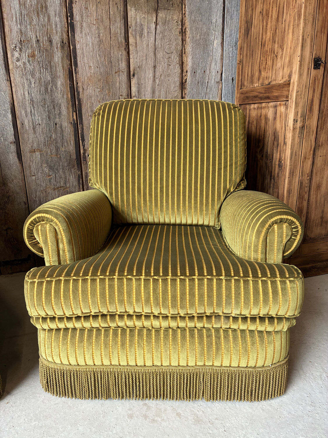 Pair of green recliner chairs