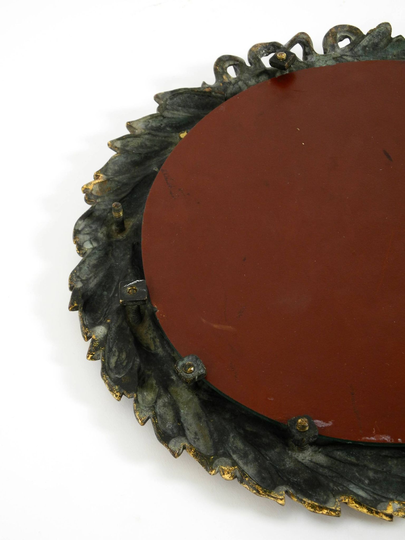 Beautiful small French mid-century wall mirror with an ornate brass frame