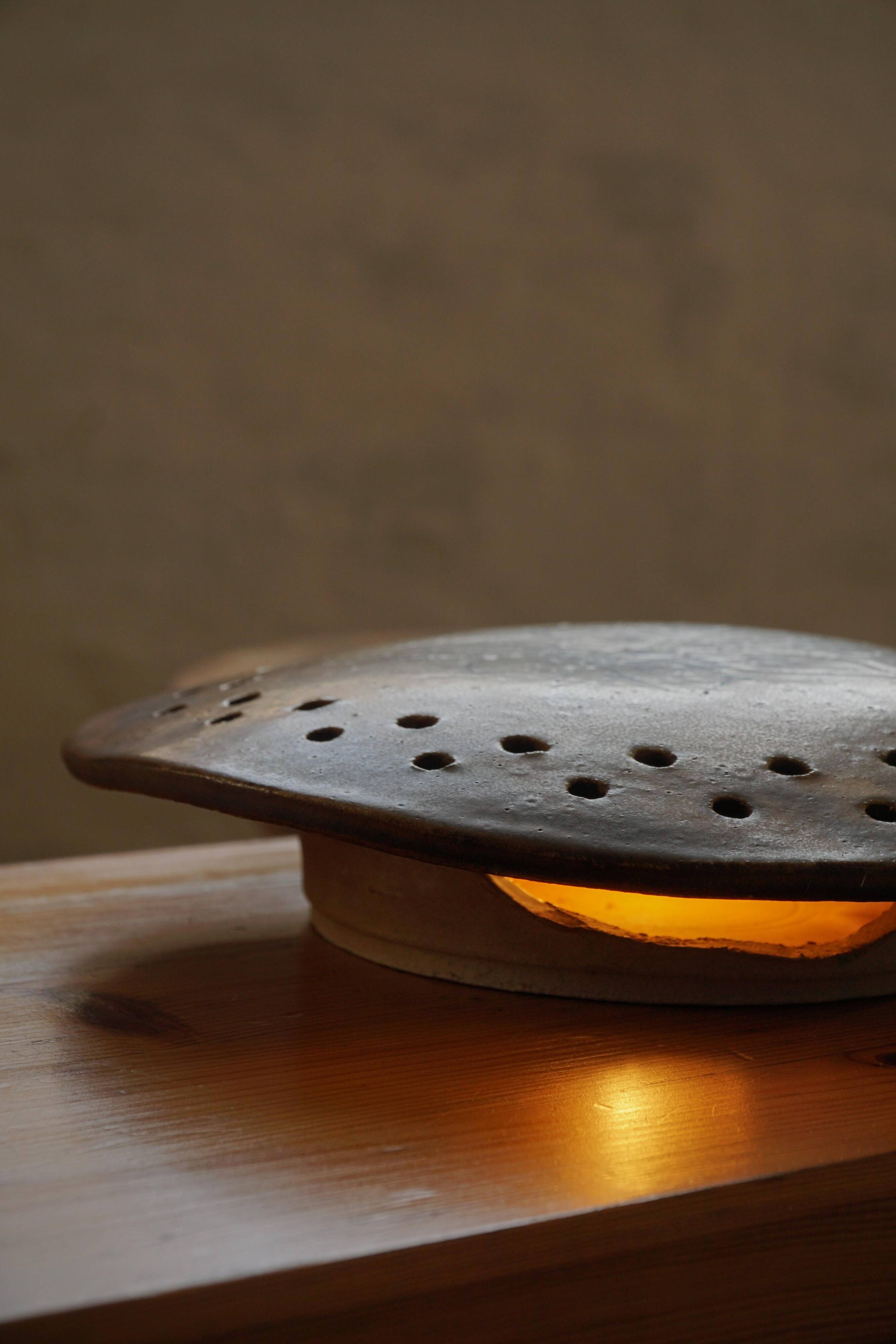 Mid-century sculptural wall light in organic Danish ceramic, 1970.