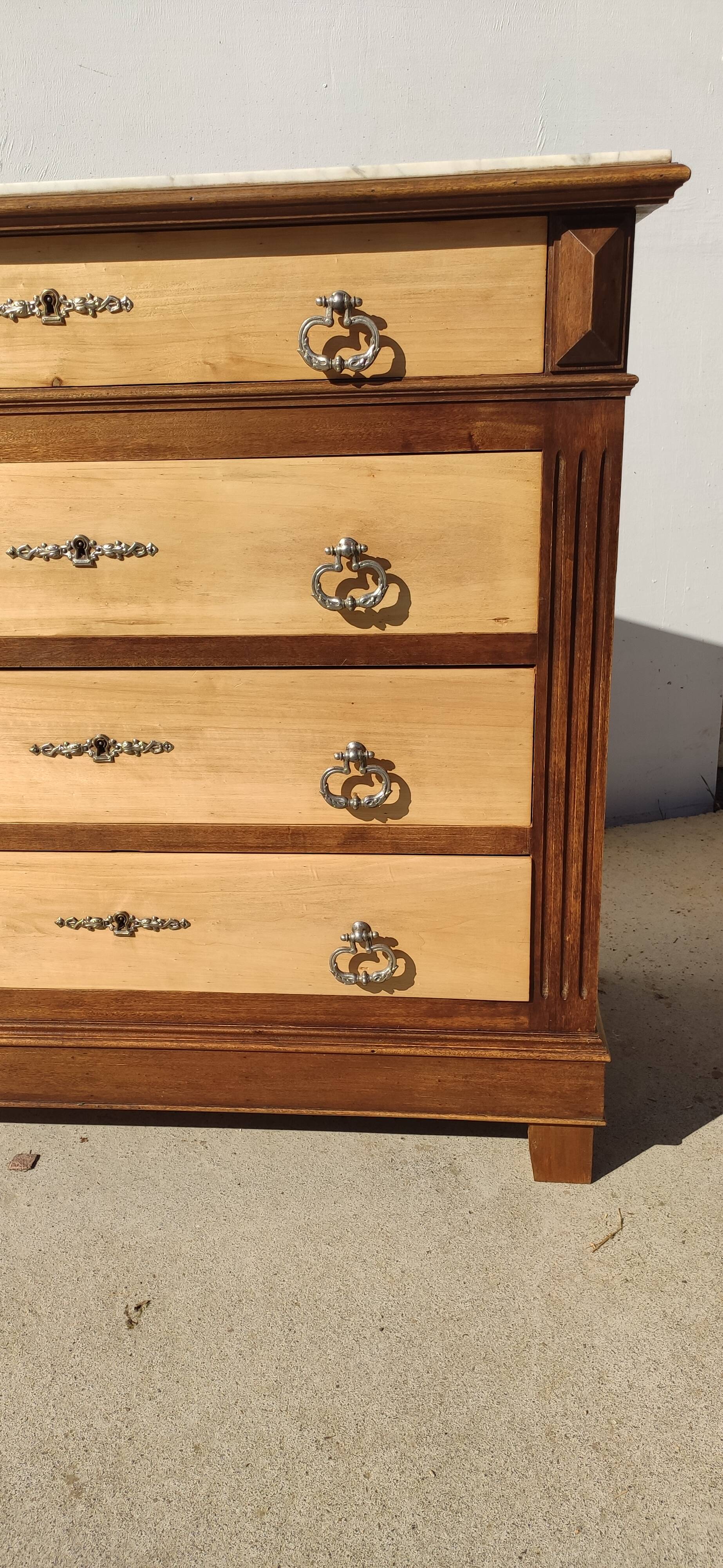 Old chest of drawers, white marble top.