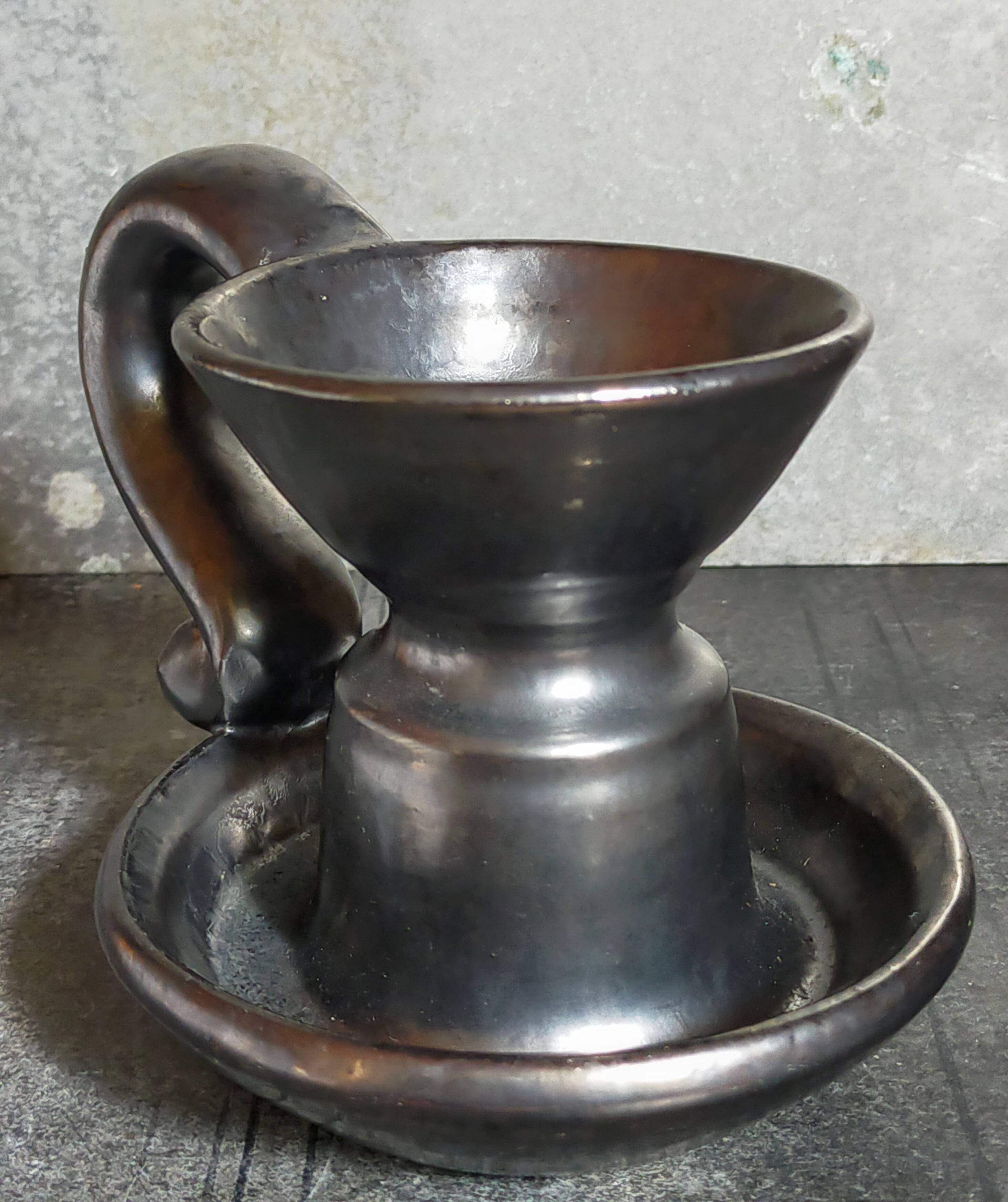 1950s iridescent black ceramic hand candle holder