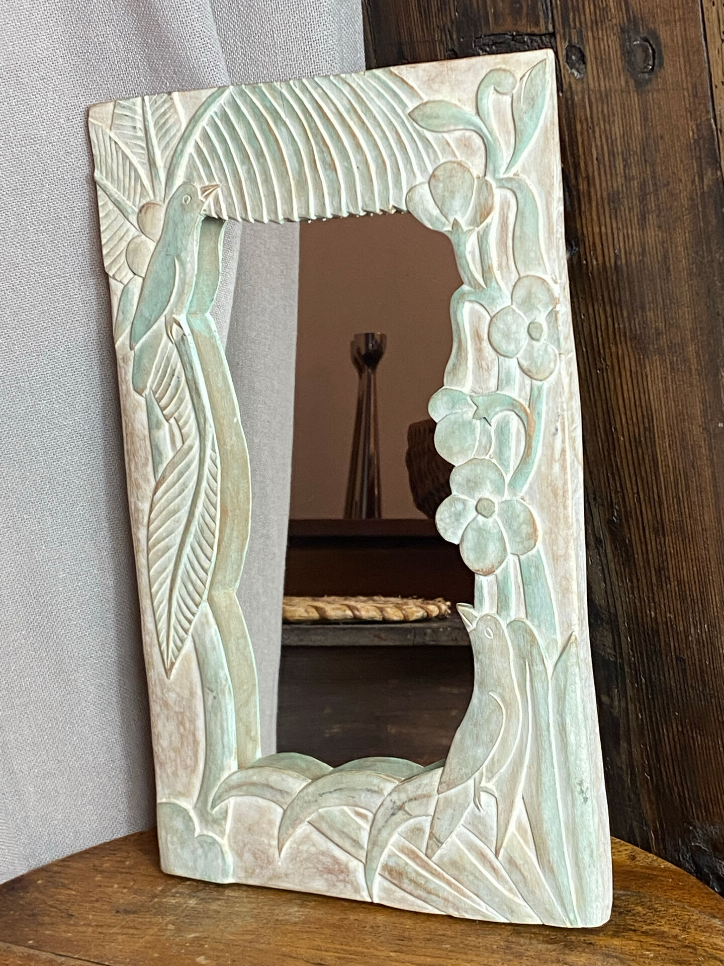 Carved wooden mirror