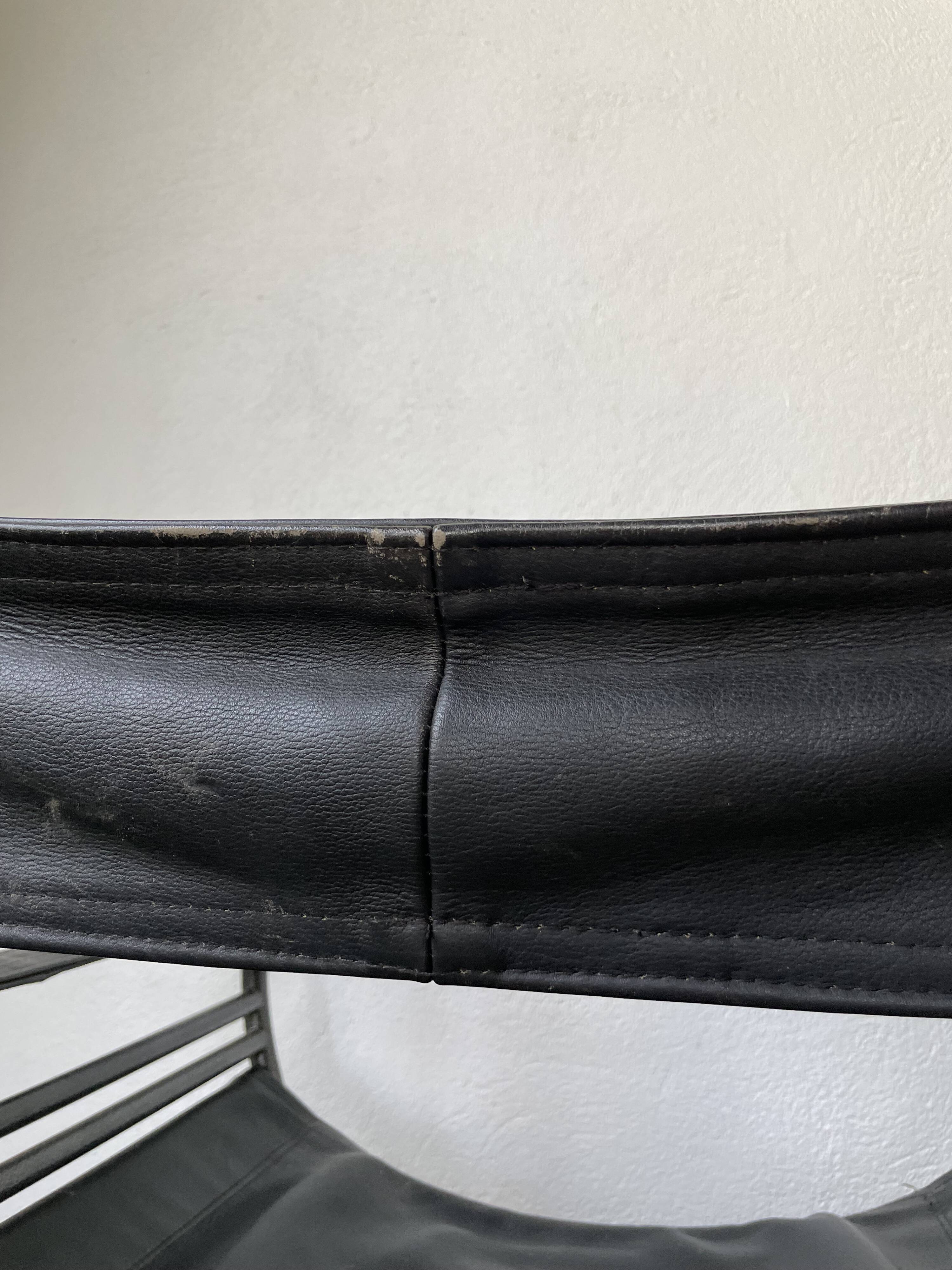 Pair of leather “curule” emperor armchairs