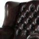 Dark brown cowhide Chesterfield wingback armchair in classic English style