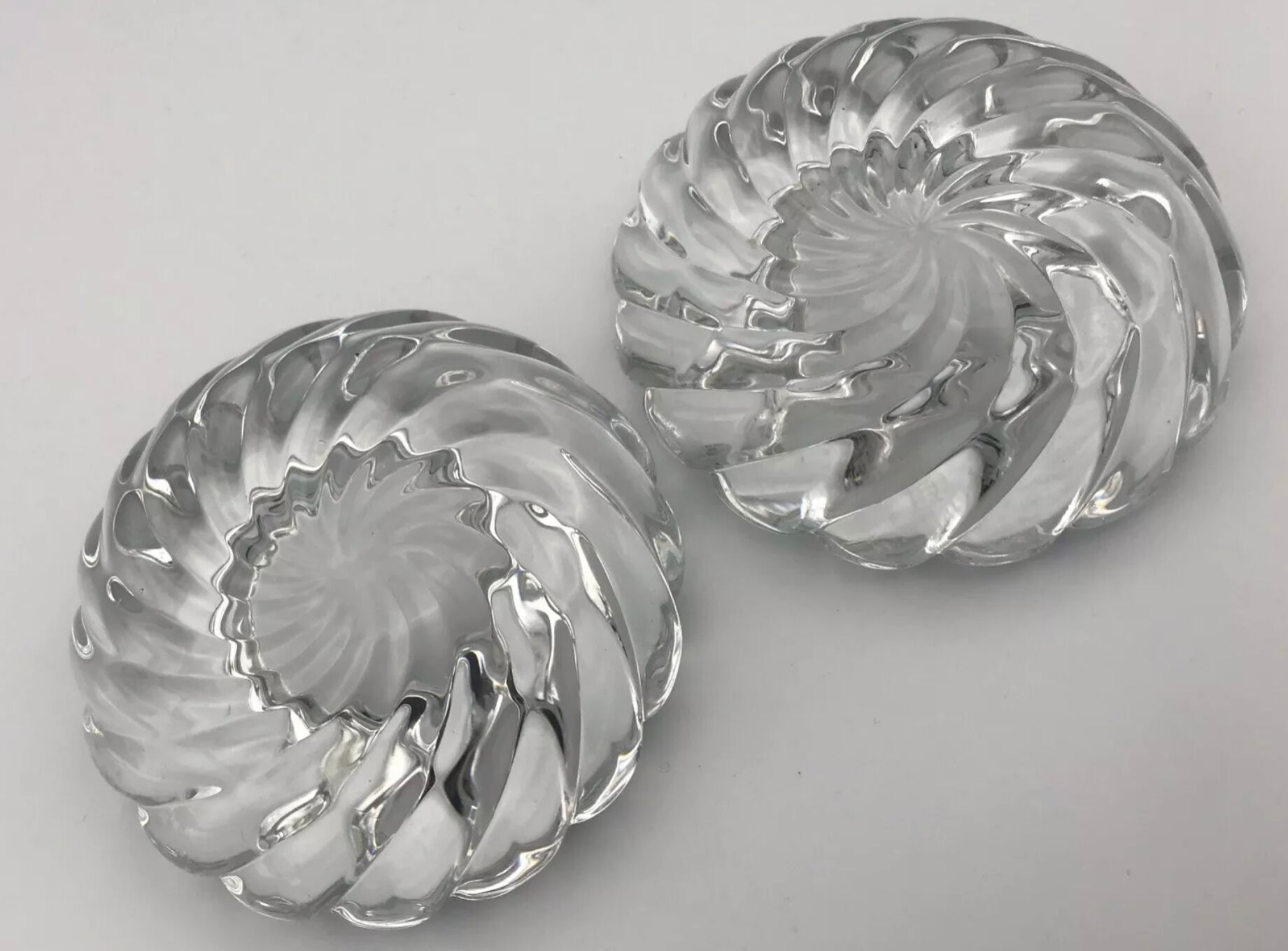 Pair of twisted round candlesticks in baccarat crystal stamped