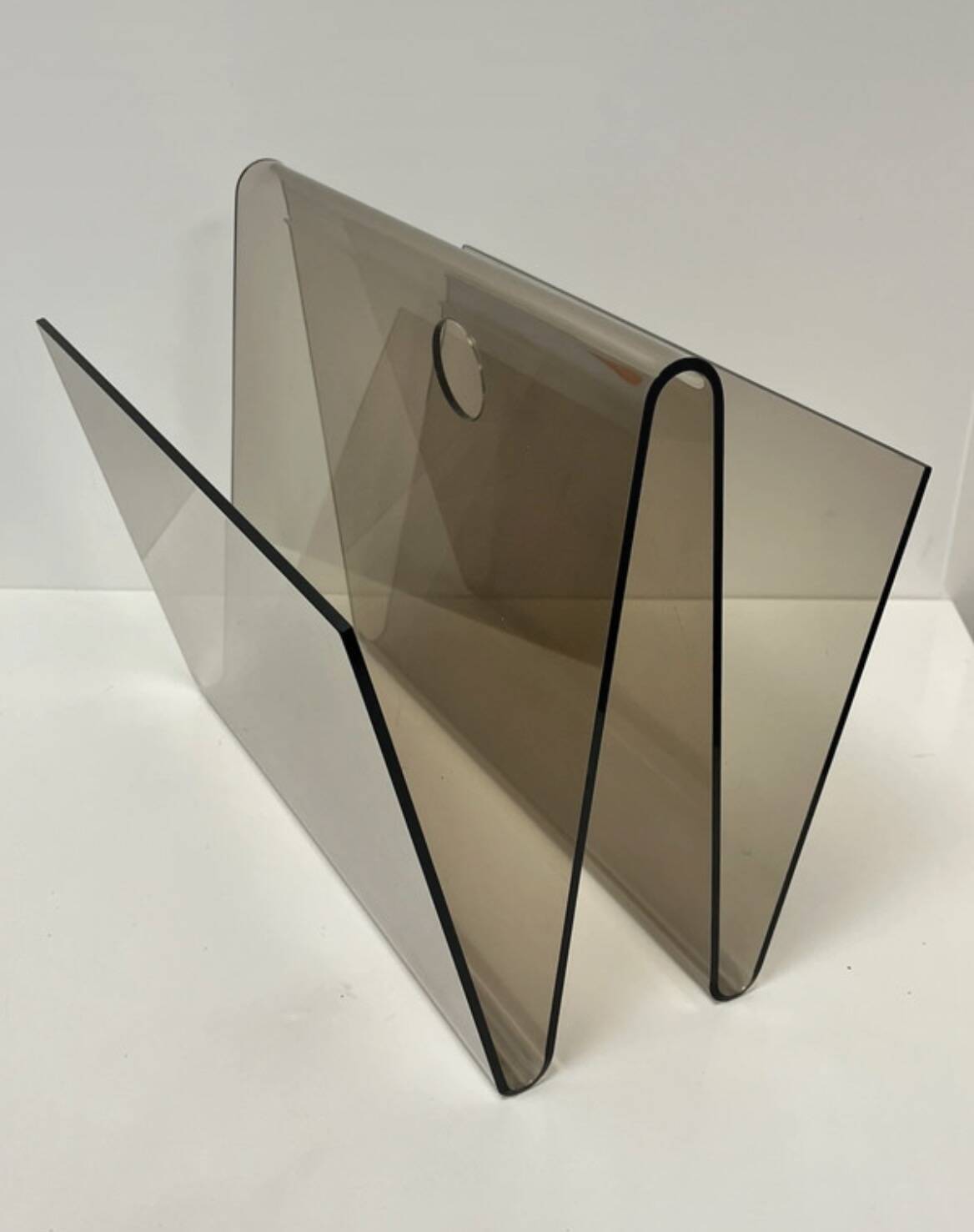 Smoked plexiglass magazine rack in the style of Michel Dumas, France, 1970s.