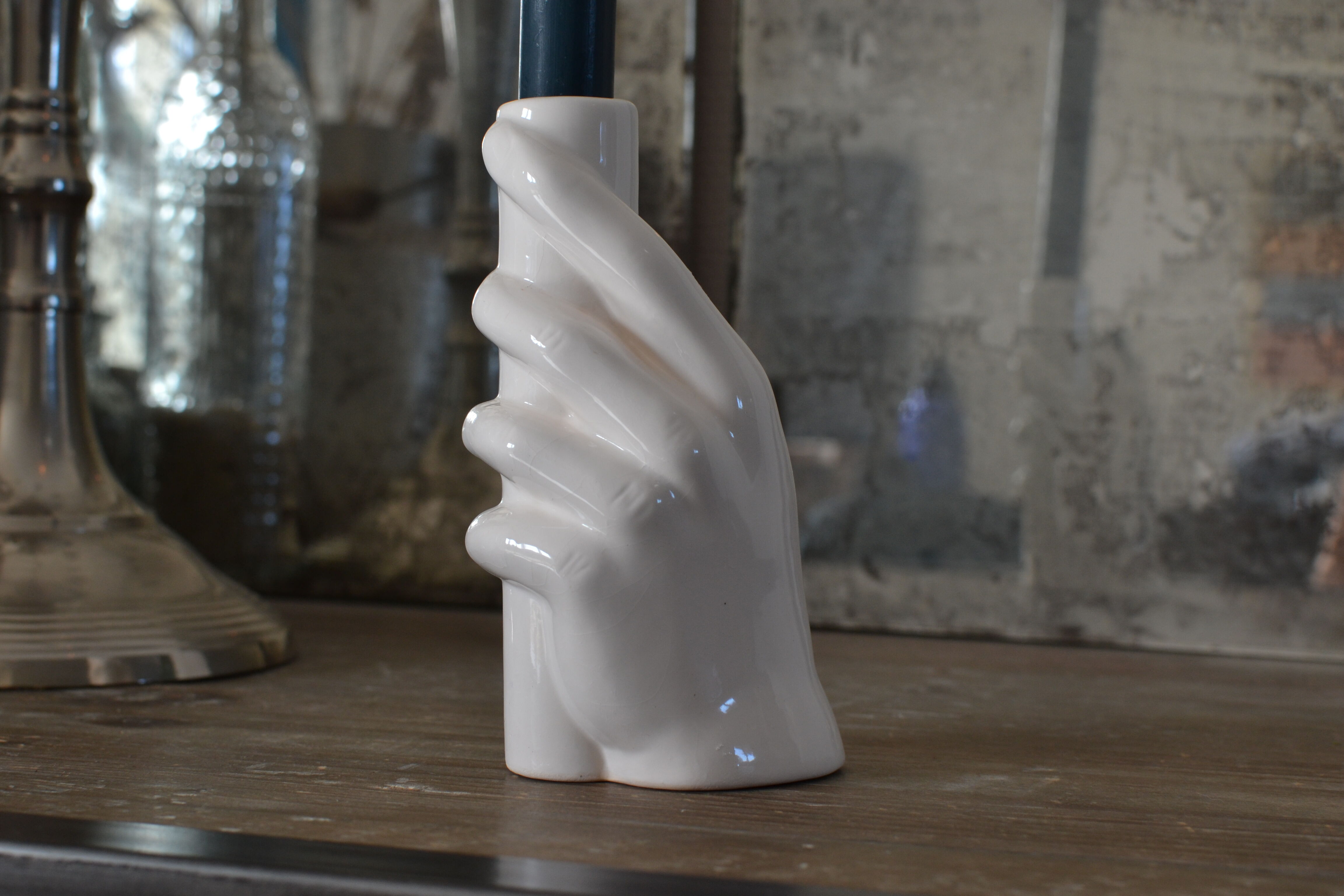 Candle holder for ceramic hand candle
