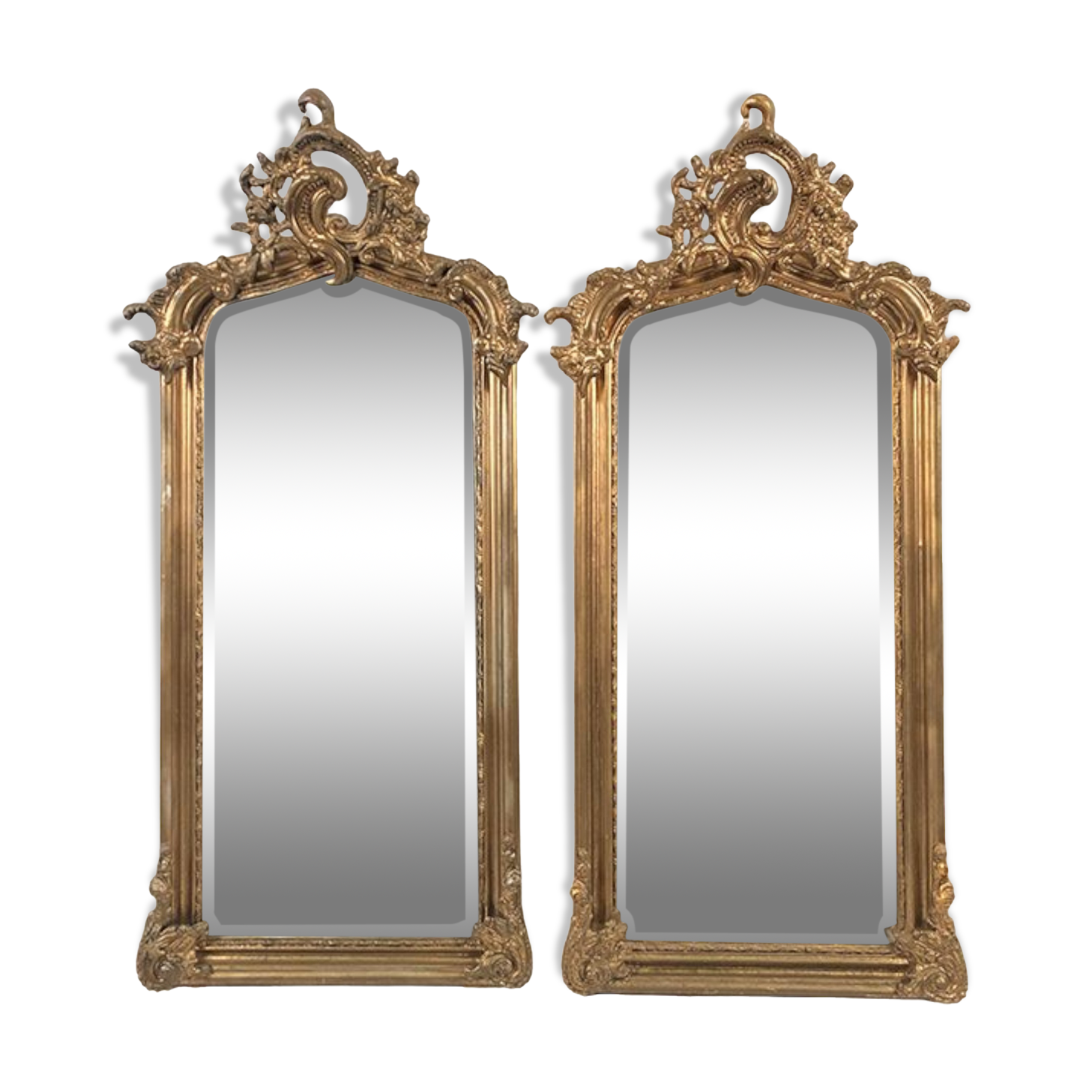 Pair of Louis XV style mirrors, stuccoed and gilded wood, beveled mirrors