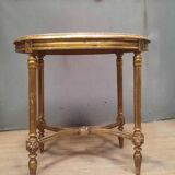Oval coffee table in gilded wood in the Louis XVI style.