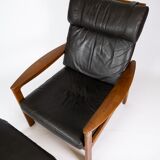Easy chair with stool in teak upholstered with black leather design Arne Wahl Iversen
