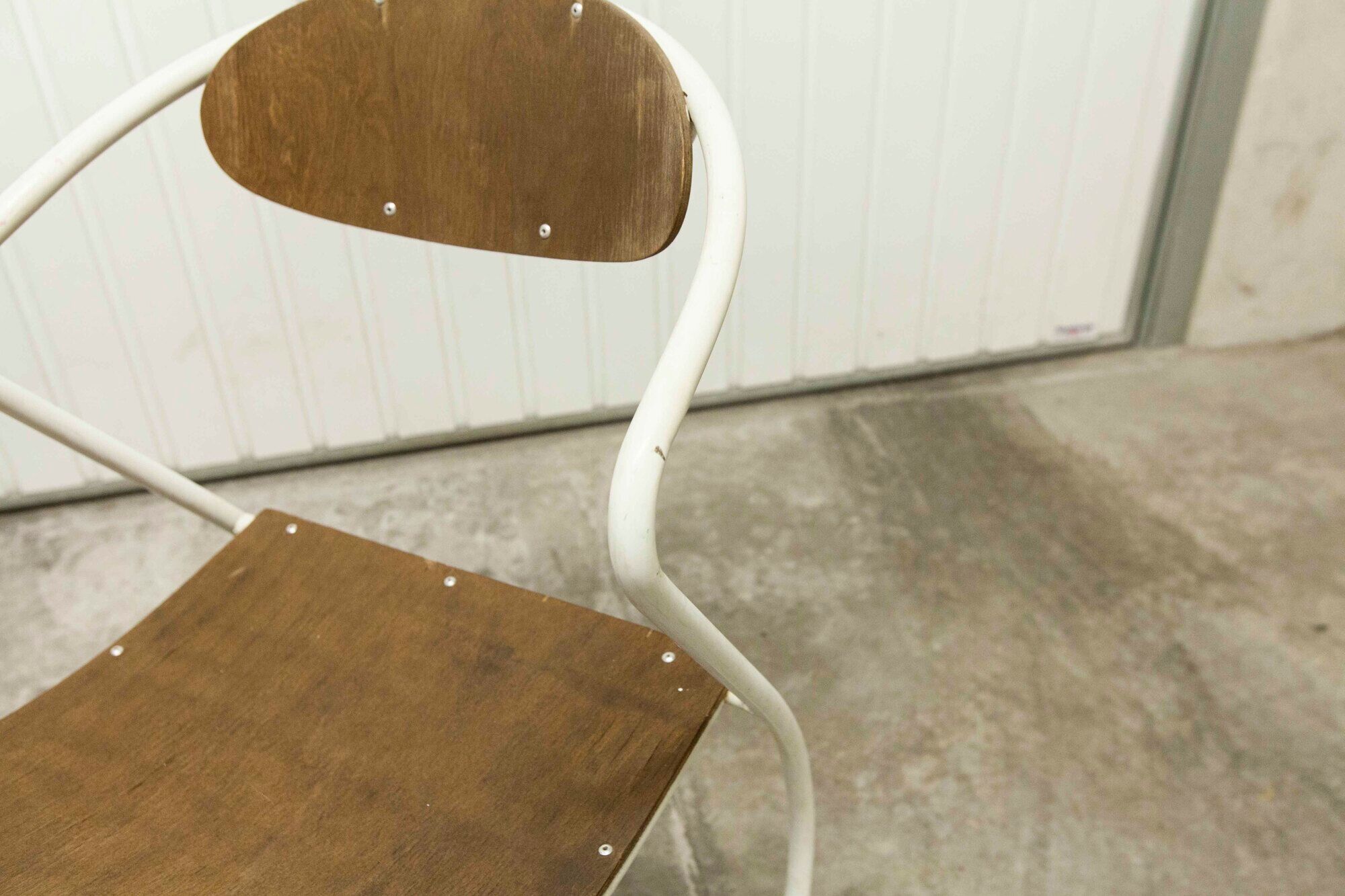 Atypical chair of the 70s metal and wood