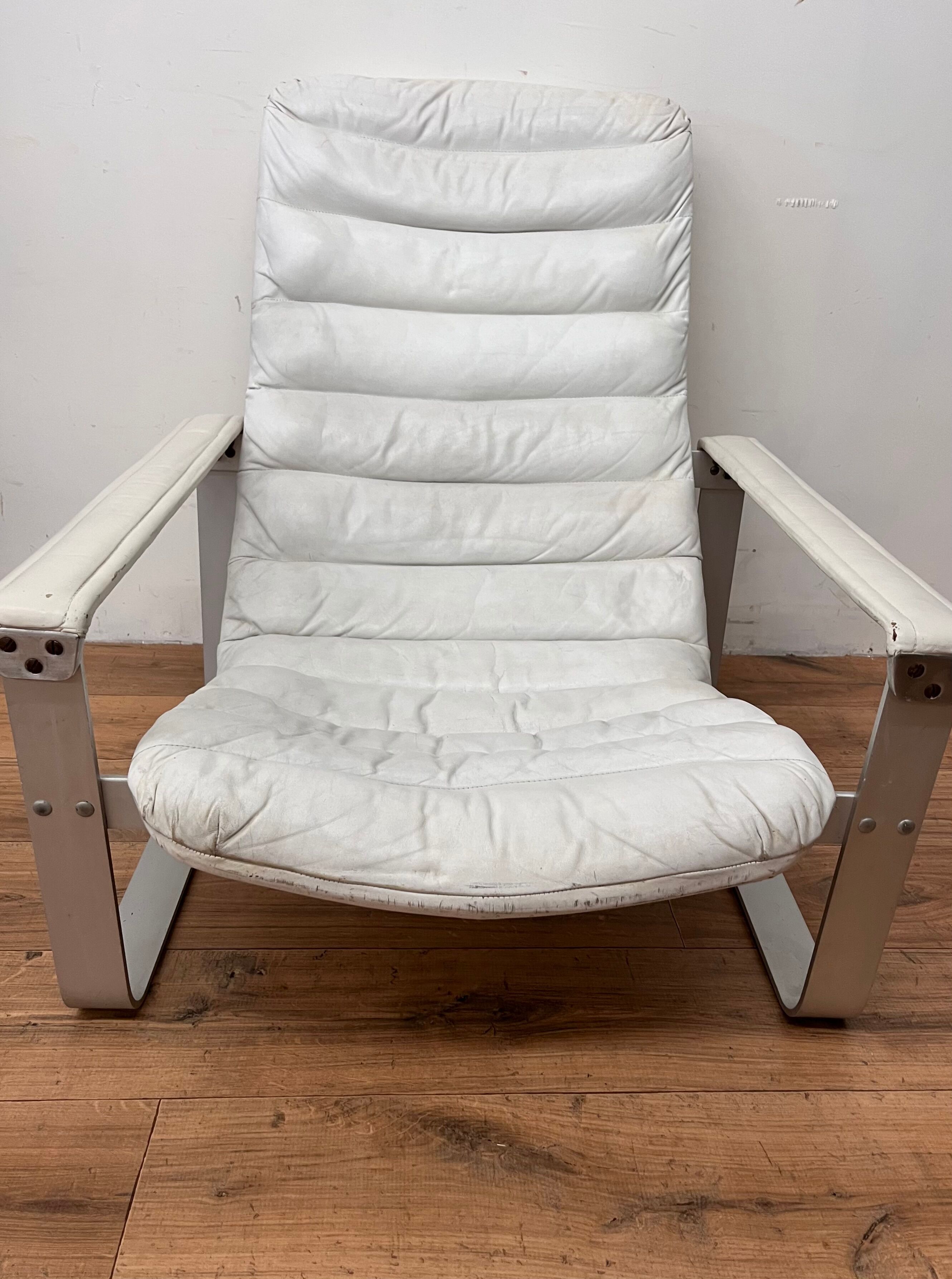 Pulkka armchair by Ilmaria Lappalainen and its ottoman