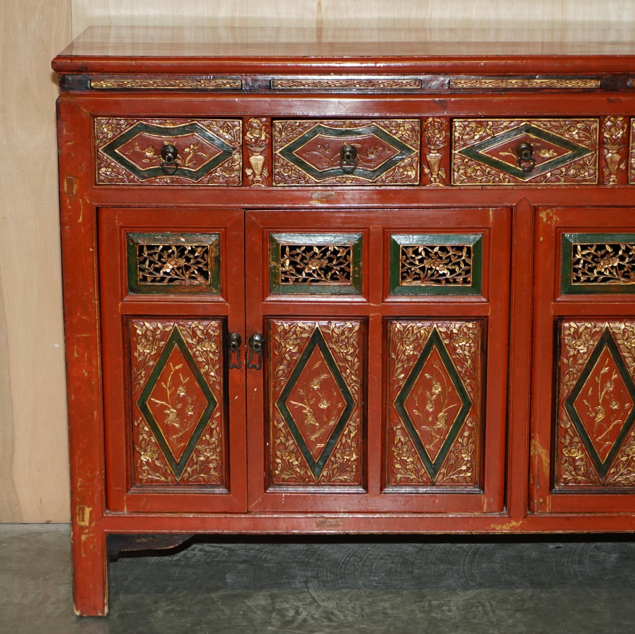 Vintage Chinese lacquered buffet decorated with gold leaf.
