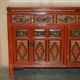 Vintage Chinese lacquered buffet decorated with gold leaf.