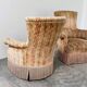 Pair of sculptural Hollywood Regency lounge chairs with original fringed upholstery