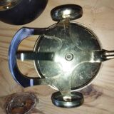 Original vintage ashtray on a small wheeled stand.