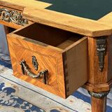 Louis XVI style marquetry desk. The top is decorated with green leather.